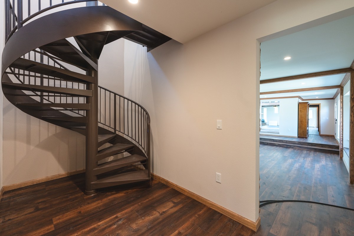 Poplar fire rebuild — living room with stone fireplace